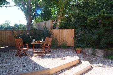 One of the bedrooms opens out onto this little raised seating area, just above the main gardens.