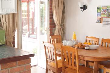 The dining-area is between the kitchen-area and the conservatory.