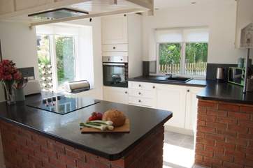 The light and bright kitchen, cooking up a storm.
