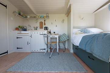 Looking in from the front door. With the bedroom to the right and the en suite shower-room behind the door on the left.