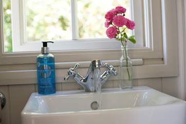 A wash-basin and proper flushing toilet.