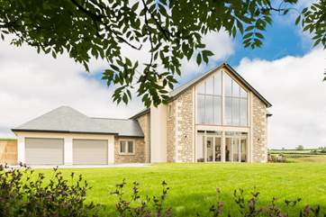 The Owners live in the semi-detached annexe behind the garages, totally separate and from the house.
