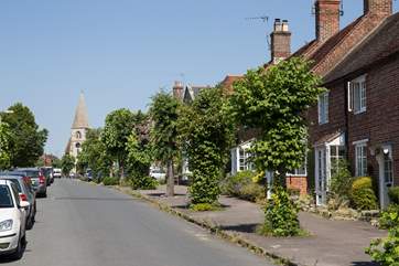 The quiet and pretty High Street in Hindon is lined with lime trees.