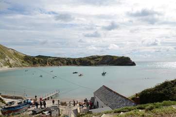 Lulworth Cove on the Jurassic Coast is impressive at any time of year. If you are feeling energetic take the coastal path to Durdle Door another iconic feature on this World Heritage coastline.