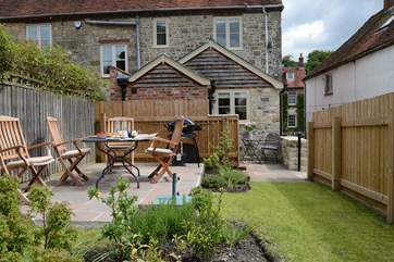 The enclosed very private and sunny garden is the perfect place for a BBQ.