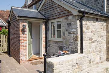 The entrance to Orchard View, is down the driveway beside the house, the south facing terrace catches the morning sun.