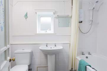 The bathroom is on the ground floor next to the kitchen.