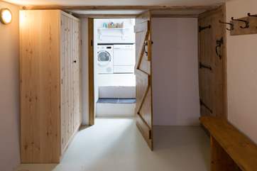 Steps from the large storage room into the utility-room.