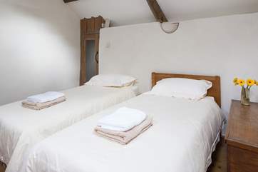 Bedroom 3 accessed by its own wooden staircase.