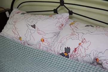 Pretty linens in bedroom 1.