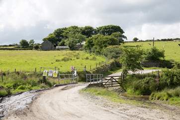 The cottage approach is over a small bridge.