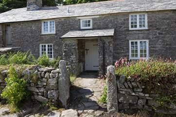 A cobbled path leads up to the front door.