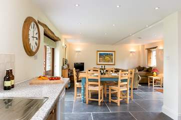 The light and airy open plan living-room has plenty of space for all.