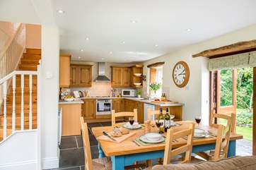 Double doors lead off from the dining-area to the garden.