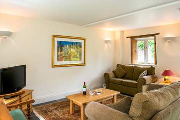The sitting-area is at the far end of the living-room.