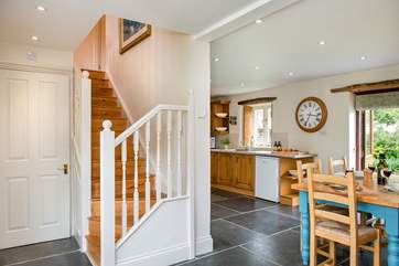 The stairs lead from the living-room to the first floor.