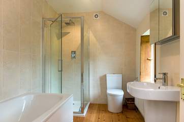 The family bathroom has a bath and a separate shower.