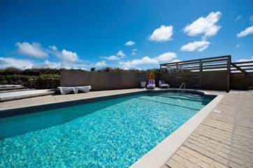The shared outdoor swimming pool.