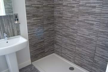 The shower-room has a huge double shower.