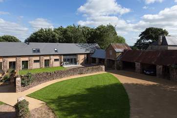 The Long Barn - in the corner of this photo with its open fronted barbecue barn to the right is stunning. A truly exceptional barn conversion in a very historic setting.