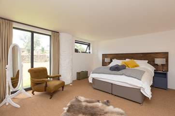 The bedroom is on the ground floor and has a king-sized bed. This can be made up as twins if you choose.