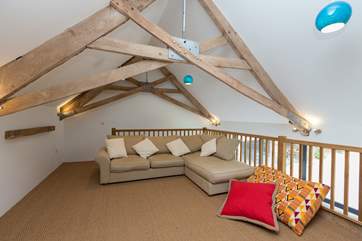 Another view of the mezzanine sitting-room which is above the kitchen/dining area.