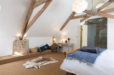 The first floor bedroom is so spacious, with an ultra contemporary en suite shower-room (a screen is provided for modest guests).