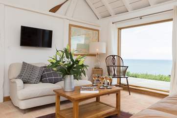 The full height glass doors to the terrace allows the light to flood in.