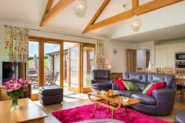 The spacious open plan living area is beautifully furnished.