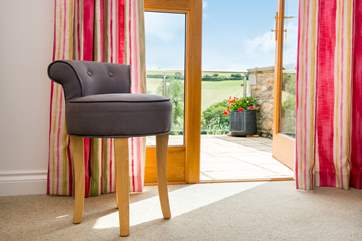 Both double bedrooms have patio doors leading outside.