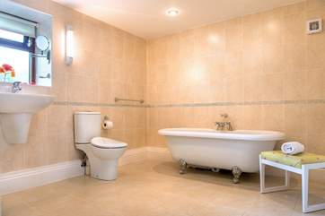 The bathroom is very spacious and has a gorgeous free-standing bath...