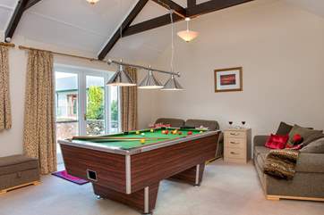 The snug area has plenty of comfy seating so spectators can enjoy watching those battling it out on the table.