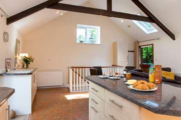The stairs lead down from the living area to the bedrooms on the ground floor.