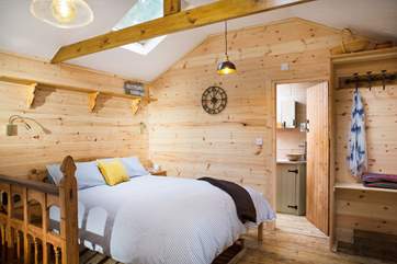 The shower-room is right next to the bed