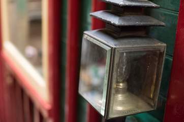 Old coaching lamps light the steps and entrance.