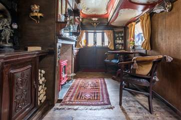 The gorgeous living-room is complete with comfy dining-area.