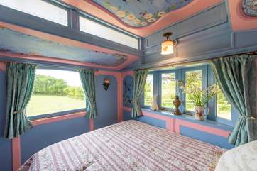 A gorgeous bedroom with a gorgeous view.