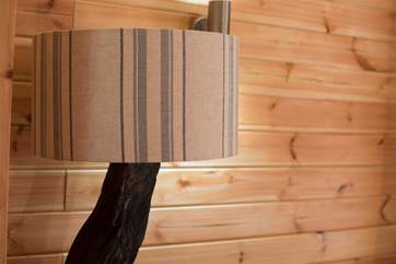 A lovely lampstand made from a tree trunk.