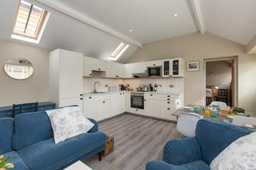 The cottage has bright and welcome open plan living space with the ensuite bedrooms at opposite ends of the cottage.