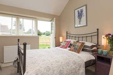 This is the second double bedroom, which has a door to the garden.