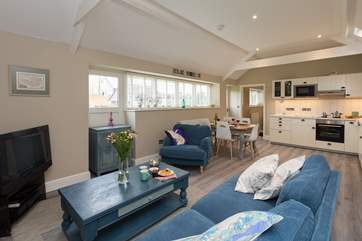 There is a spacious open plan living area, with the two bedrooms - one is en-suite and one has a separate bathroom next to it - at opposite ends of the cottage.