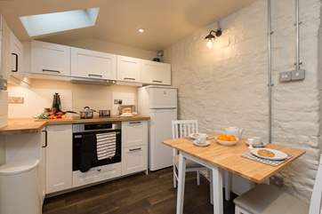 The kitchen/dining room is beautifull designed with lots of very clever bespoke design features to add a contemporary twist to the old cottage.