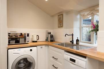Another view of the kitchen. The window looks out over the rear garden and patio.