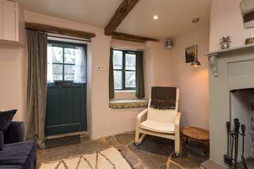 The front door opens into the living from the beautiful front garden - there is a fully enclosed rear garden too.