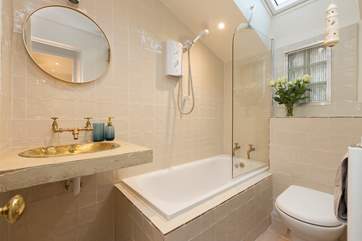 The brand new bathroom is on the ground floor, off the kitchen. The unique Moroccan copper sink is a wonderful touch.