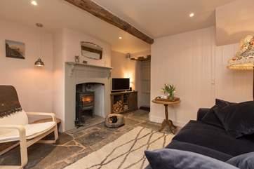 This cosy cottage has a wonderful wood burning stove in the living room and original flagstone floors
