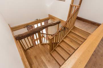 The bespoke wooden staircase is a wonderful design feature in its own right.