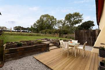 There is a very completely private rear garden with a decking-area as well as a lovely lawn, looking out over the fields.