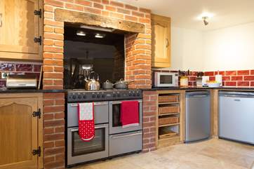 The kitchen has a large range cooker at its heart.