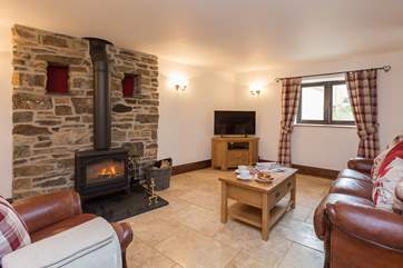 The living area has a wood-burning stove for those autumn and winter evenings, or simply for extra snug atmosphere after a day out walking.